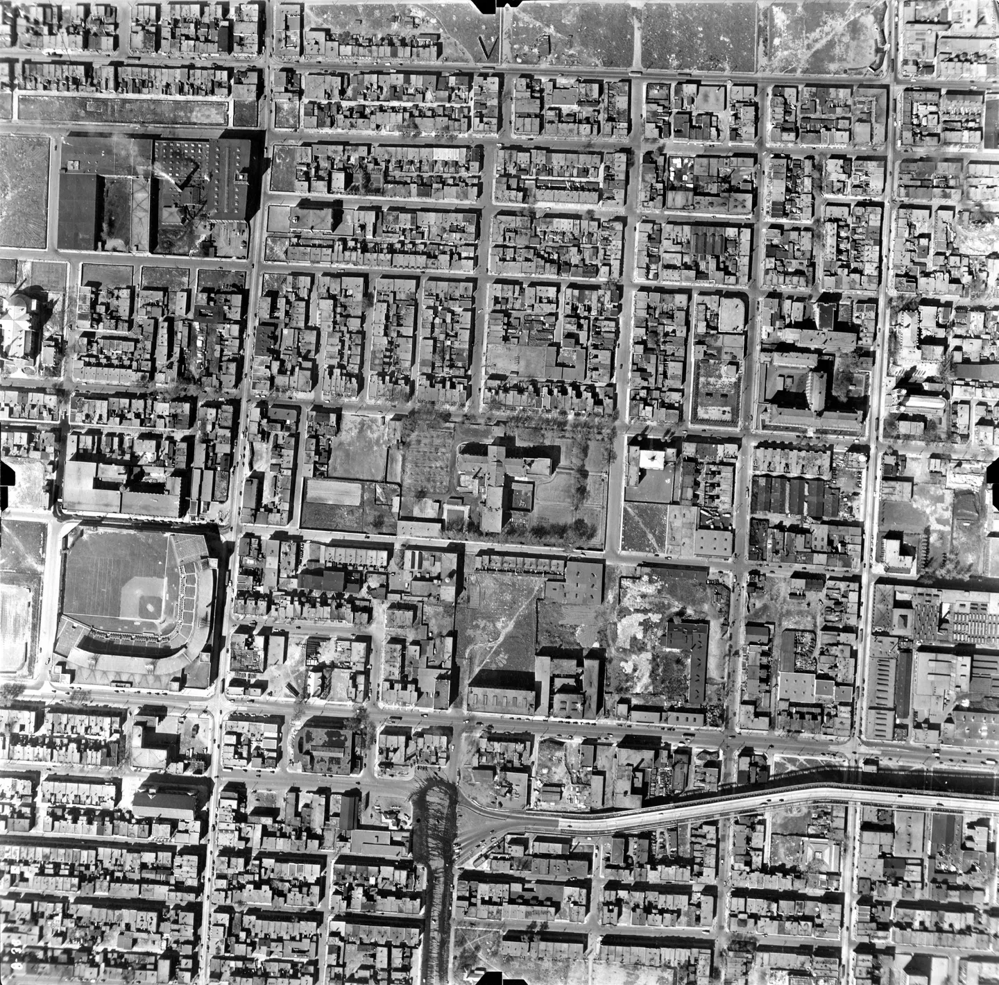 Centre-Sud street with buildings, cars and baseball field